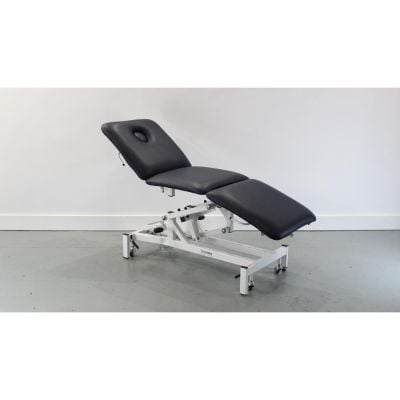 Mediplinth 3 Section Hydraulic Couch with Dark Blue Upholstery & Breathe Hole at its middle height looking the couch design