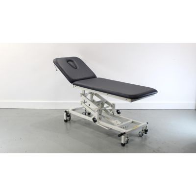 Akron Merit 3221 2 Section Hydraulic Couch with NEW Dark Blue Upholstery & Breathe Hole image showing couch on its mid height with the head section lifted