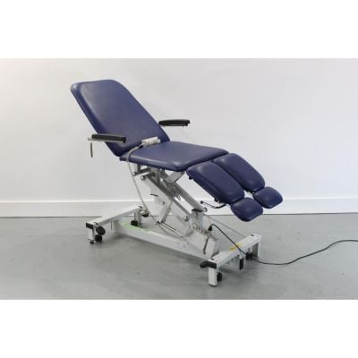 Plinth Podiatry / Orthopedic Electric Tilting Chair with Dark Blue Upholstery facing mid height foot section lowered