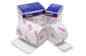 Two rolls of Hypafix adhesive tape in front of branded packaging, showing the 5cm x 10m medical dressing tape used for secure fixation of dressings and medical devices.
