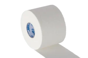 A roll of white zinc‑oxide strapping tape partially unrolled, showing the rigid adhesive material used for joint support, injury prevention, and secure athletic strapping.